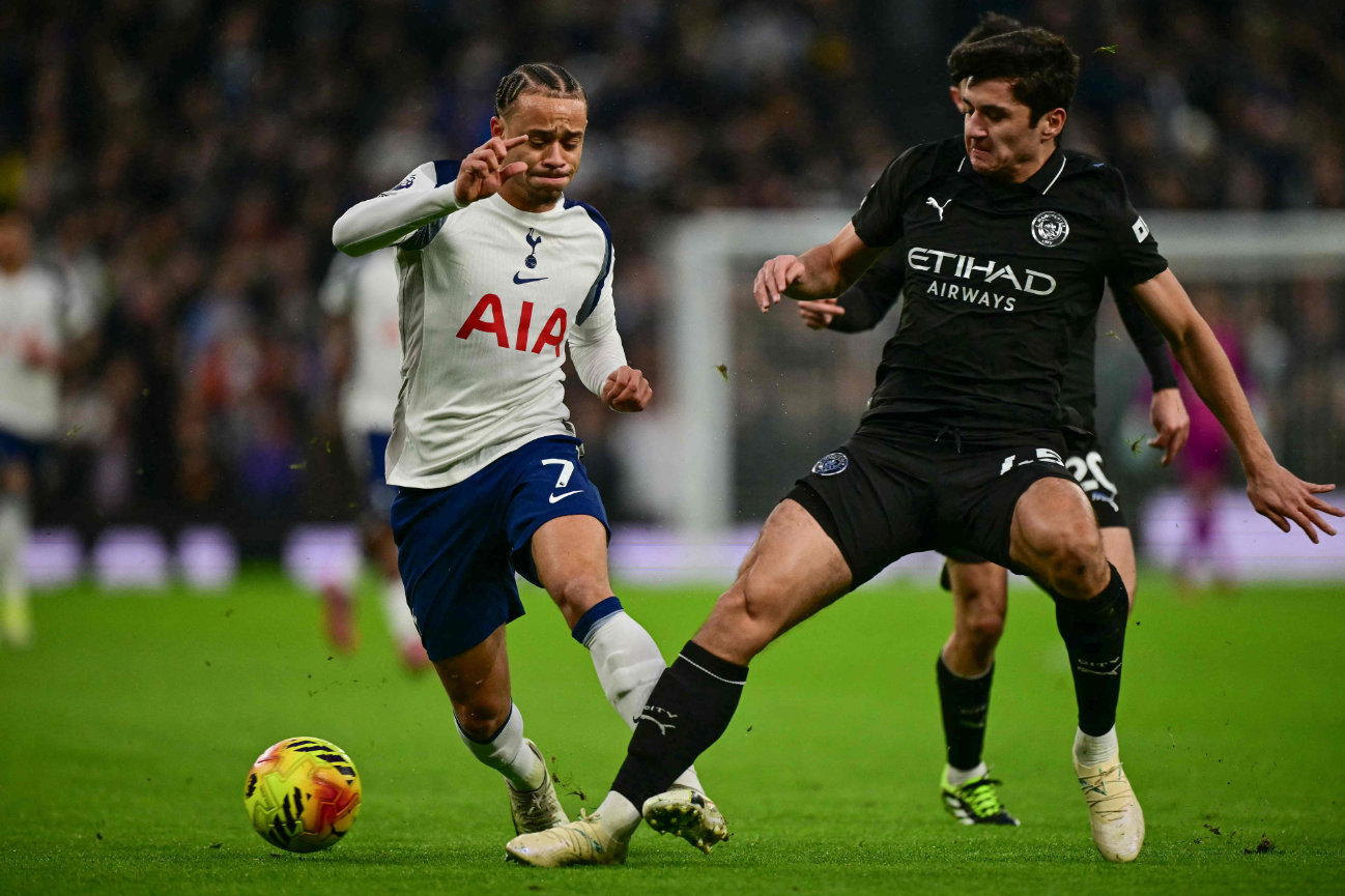 Manchester City's Uzbek defender #45 Abdukodir Khusanov (R) challenges Tottenham Hotspur's Dutch midfielder #07 Xavi Simons (L) during the English Premier League football match between Tottenham Hotspur and Manchester City at the Tottenham Hotspur Stadium in London, on February 1, 2026. (AFP)