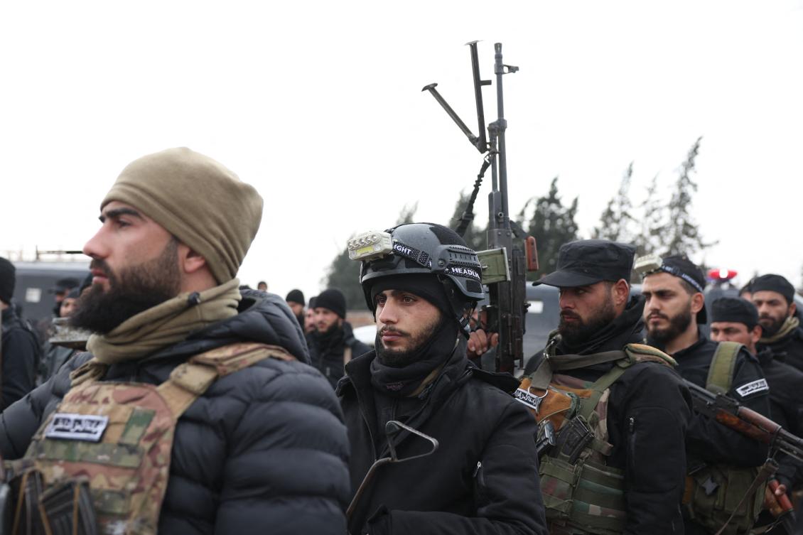 Members of the Syrian government internal security forces gather in the northern Syrian town of Sirrin as they wait to enter the city of Kobane on February 2, 2026. (AFP)