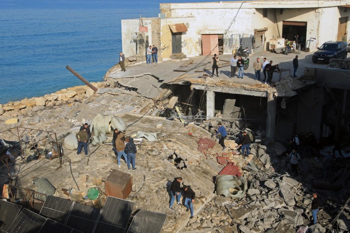 People gather at the site of a building that was destroyed by the Israeli strike in the industrial area of Ghazieh town, near the coastal city of Sidon, in southern Lebanon on January 6, 2026. (FILE/AFP)