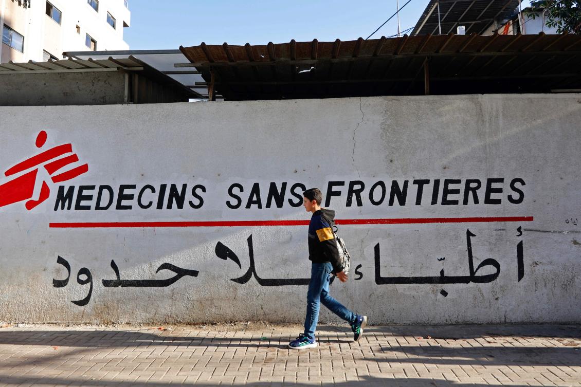 A Palestinian boy walks past the clinic of Doctors Without Borders or Medecins Sans Frontieres (MSF), in the Al-Rimal neighborhood of Gaza City on January 11, 2026. Israel said on February 1, 2026 it was terminating the humanitarian operations of the international charity in Gaza after the organization failed to provide a list of its Palestinian staff. (AFP/File Photo)