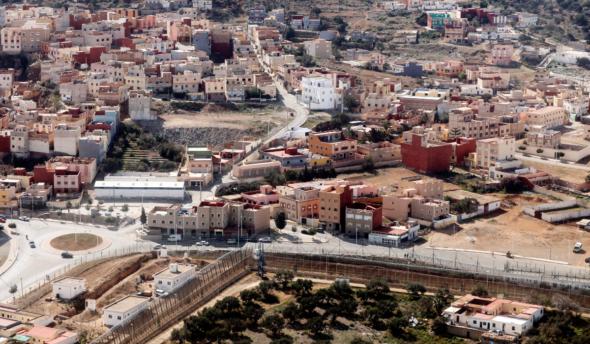 This aerial view taken on February 24, 2024 shows the border fence separating Nador in Morocco (top) from Spain's North African Melilla enclave (bottom). (AFP)