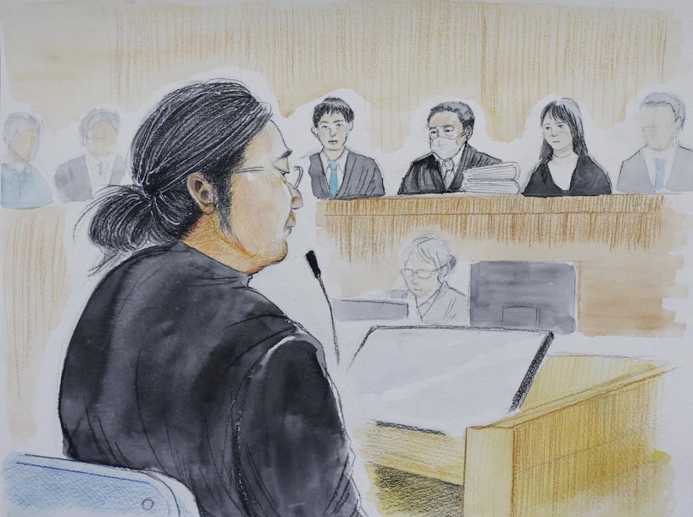 Above, a courtroom sketch depicts Tetsuya Yamagami listening to the explanation of the verdict at the Nara District Court in Nara on Jan. 21, 2026. (Jiji Press/AFP)
