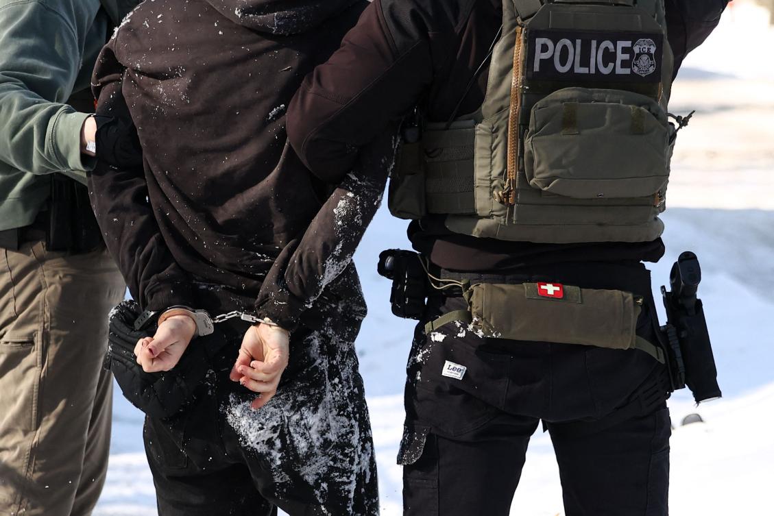 Federal agents detain a protester in Minneapolis, Minnesota on February 3, 2026. (AFP)