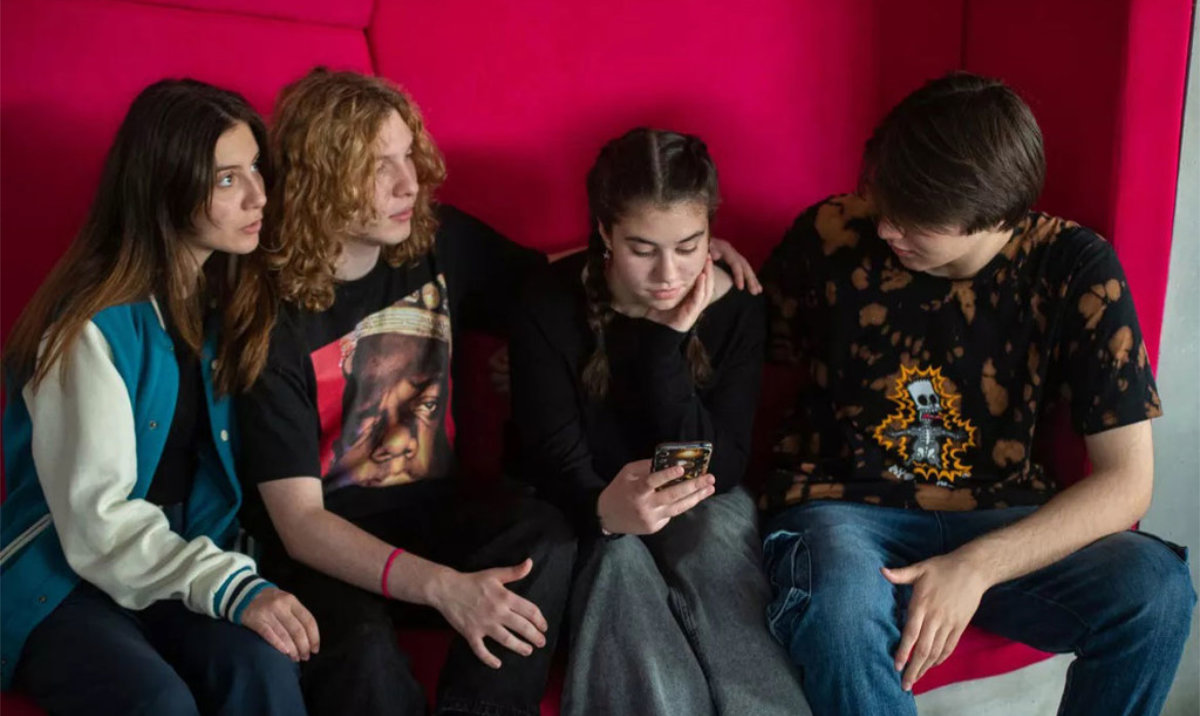 Young adults check social media in North Macedonia. (UNICEF)