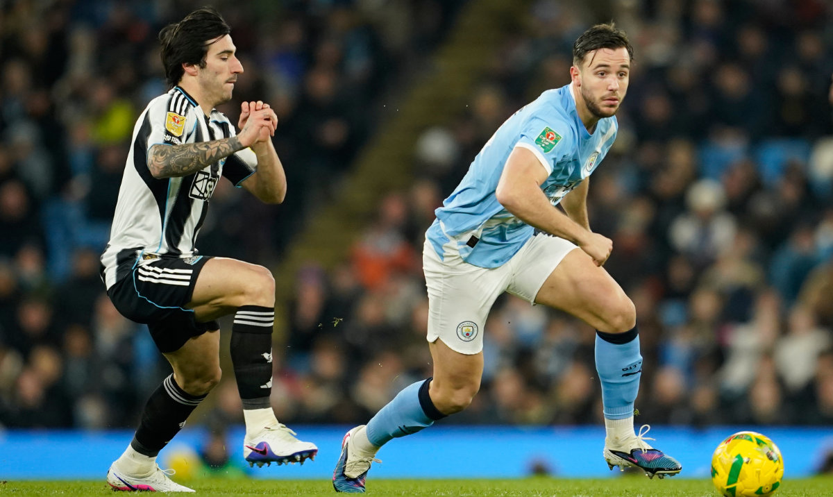 Newcastle's Sandro Tonali, left, and Manchester City's Nico Gonzalez run for the ball during the English League Cup semifinal soccer match soccer match between Manchester City and Newcastle in Manchester, England, Wednesday, Feb. 4, 2026. (AP)