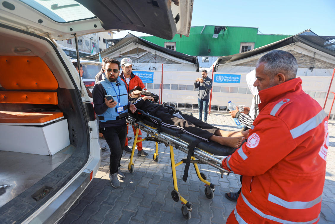 A patient is brought to an ambulance as he gets ready to leave Gaza for treatment abroad through the Rafah border crossing between Gaza and Egypt, February 5, 2026. (REUTERS)