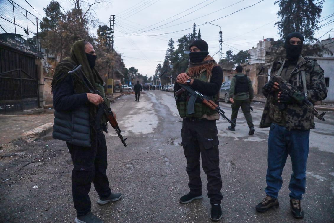 Kurdish-led Syrian Democratic Forces (SDF) combatants secure the area after the arrival of Syria's Interior Ministry security forces, deployed under an agreement aimed at stabilizing a ceasefire, in Qamishli, eastern Syria, Tuesday, Feb. 3, 2026. (AP)