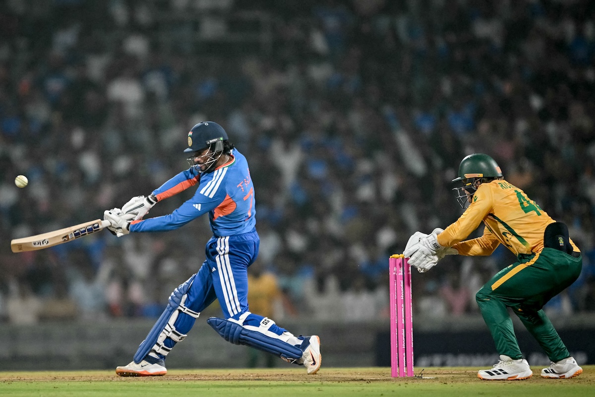 India's Tilak Varma (L) plays a shot during the 2026 ICC Men's T20 Cricket World Cup warm-up match between India and South Africa at the DY Patil Stadium in Navi Mumbai on February 4, 2026. (FILE/AFP)