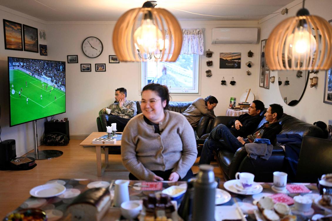 Proudly showing off photographs on her tablet of her grandson's first hunt, Dorthe Olsen refuses to let the turmoil sparked by US president Donald Trump take over her life. (AFP)
