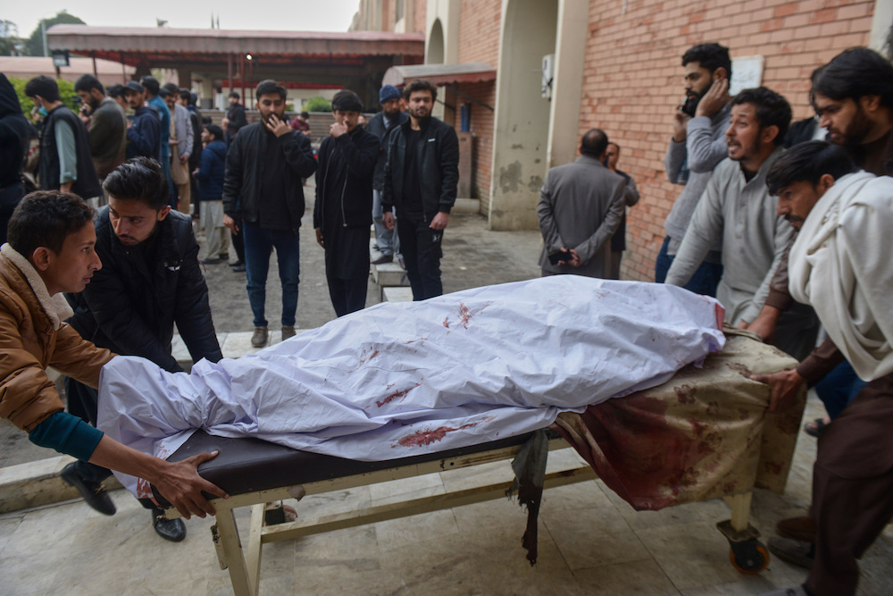 Relatives and volunteers transport a victim of bomb explosion in a Shiite mosque, from at a hospital in Islamabad, Pakistan, Friday, Feb. 6, 2026. (AP)