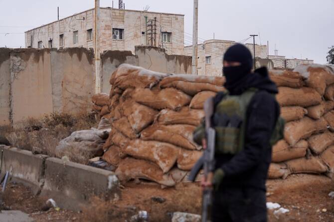 A man wearing an explosives belt blew himself up Friday while a security force was trying to arrest him in western Iraq near the Syrian border, killing himself and wounding two security members, an Iraqi security official said. (Reuters/File)