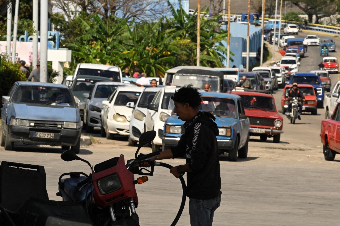 A driver fills up his tank at a gas station as Cuban President Miguel Diaz-Canel announces his government will roll out a plan in the next week to confront fuel shortages in Cuba. (Reuters)