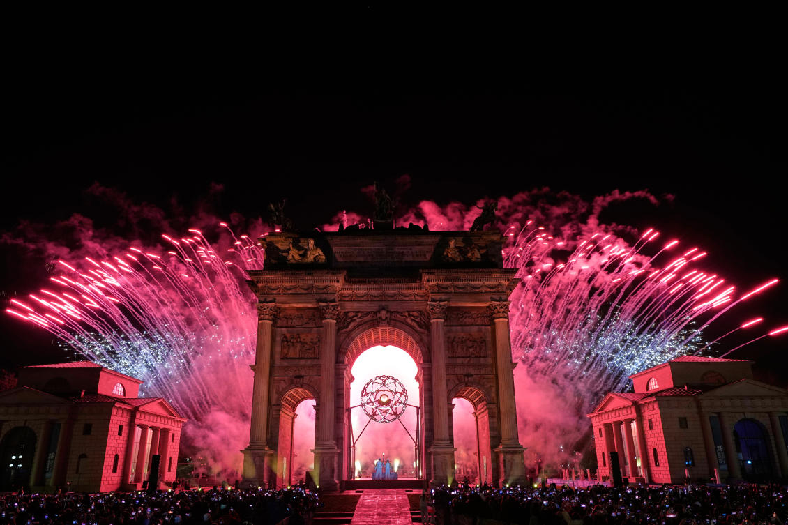 Italian former skier Deborah Compagnoni and Italian former skier Alberto Tomba light the cauldron at the Arco della Pace during the Olympic opening ceremony at the 2026 Winter Olympics in Milan on Feb. 6, 2026. (AP)