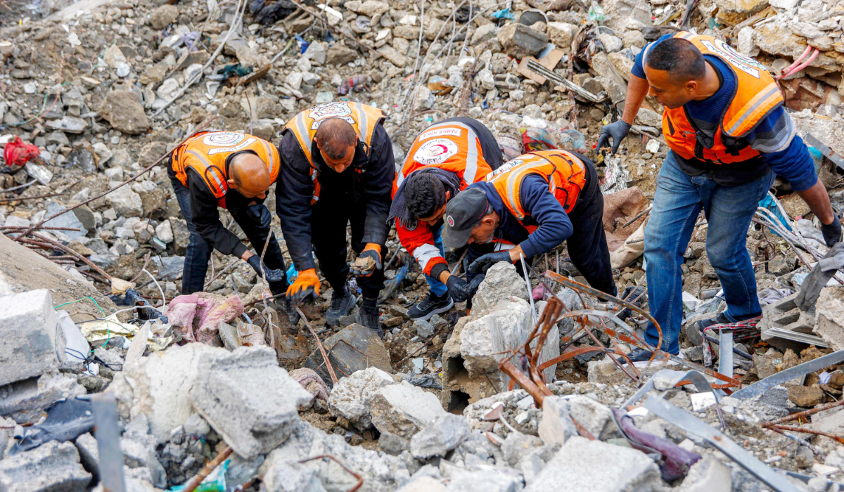 Civil defence teams search for the bodies of the Salem family under the rubble of their home, which was destroyed by Israeli forces in December 2023, in the Sheikh Radwan neighbourhood of Gaza City on February 7, 2026. (AFP)