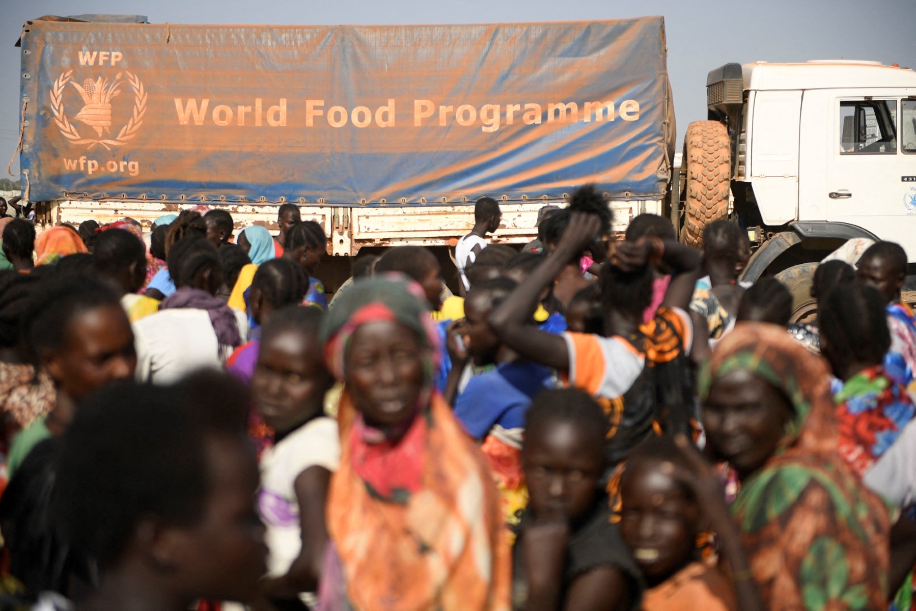 The trucks, contracted by the World Food Programme were travelling from Kosti to deliver food to starved, displaced people near the state capital, El Obeid, when they were hit, according to a statement by the UN Resident and Humanitarian Coordinator in Sudan. (AFP/File Photo)