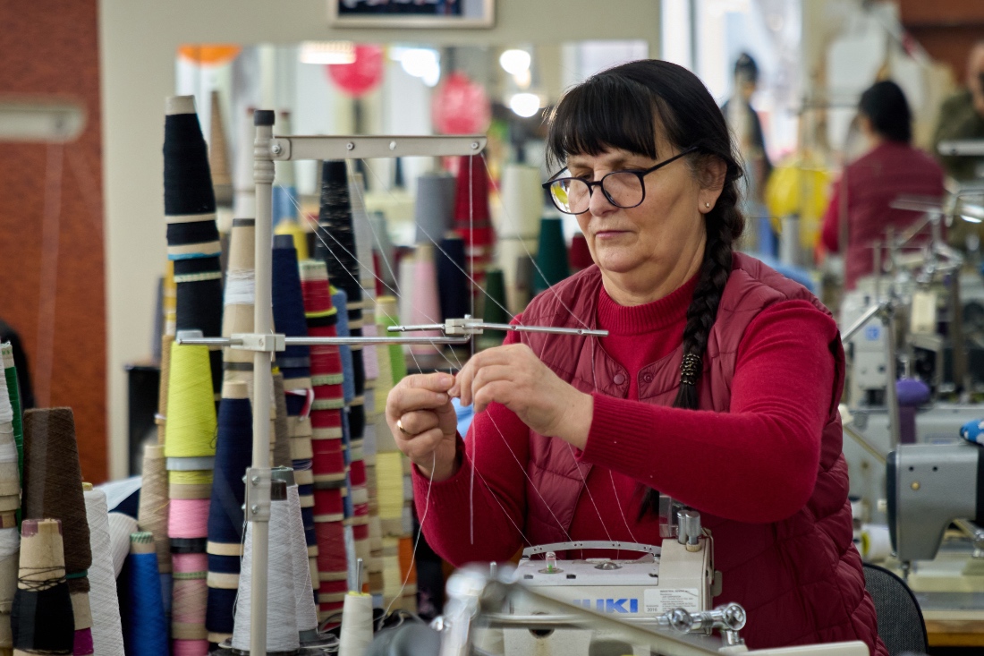 An employee of the Rito Group, a clothing company that produces knitwear, works during a blackout caused by Russia's regular air attacks on the country's energy system in Kyiv, Ukraine. (AP)