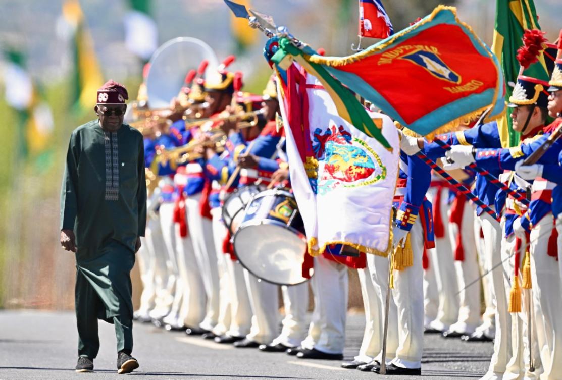 Nigeria's President Bola Tinubu reviews the honor guard during his welcome ceremony at Planalto Palace, before a meeting with Brazil's President Luiz Inacio Lula da Silva, in Brasilia, on August 25, 2025. (AFP)