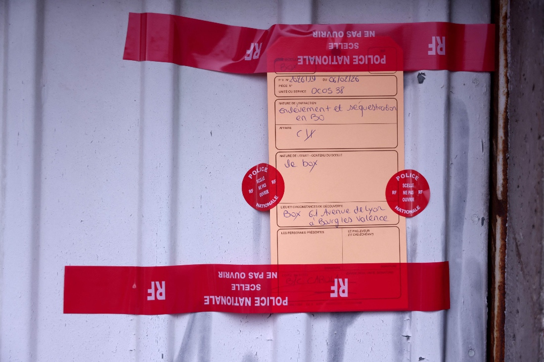 This photograph shows police seals on a garage door where two women were found injured in Bourg-les-Valence, in the Drome department, southeastern France. (AFP)