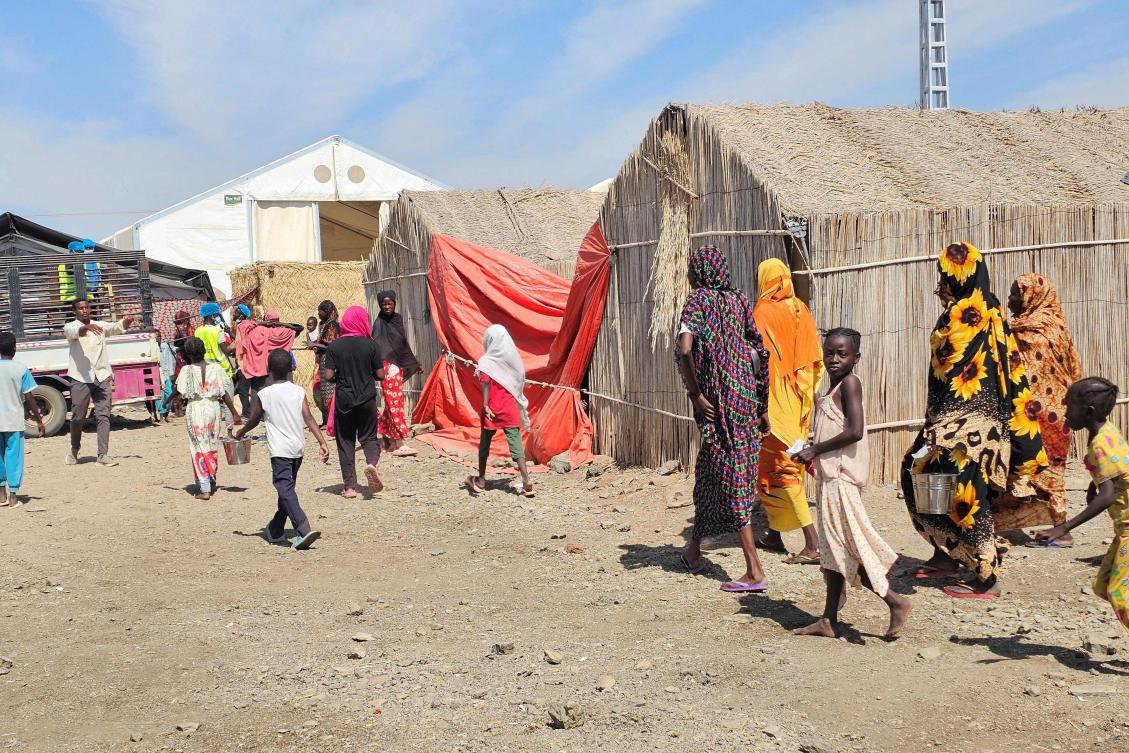 Sudanese gather near a food distribution point at the Abu Al-Naga displacement camp in Gedaref State. Fighting in the conflict is now mostly centered around the the South Kordofan region.(AFP)