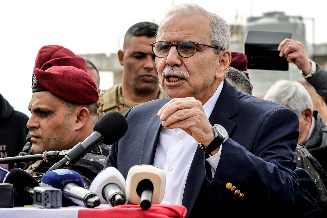 Lebanon's Prime Minister Nawaf Salam speaks to the residents and press corps during his visit to the heavily-damaged southern village of Kfar Shouba, near the border with Israel on February 8, 2026. (AFP)