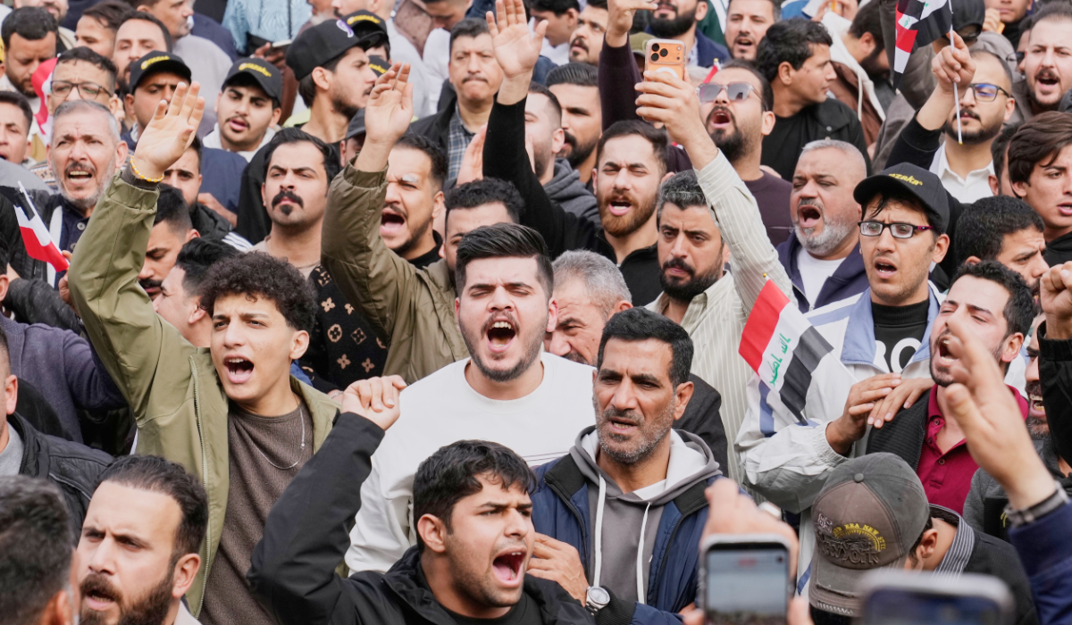 Iraqi traders protest against the imposition of customs duties on imported goods in Baghdad, Iraq, Sunday, Feb. 8, 2026. (AP)