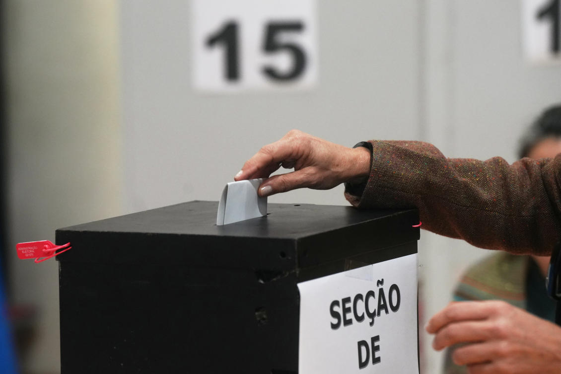 A voter casts her ballot at a polling station during Portugal’s presidential election in Lisbon, Feb. 8, 2026. (AP Photo / Ana Brigida)