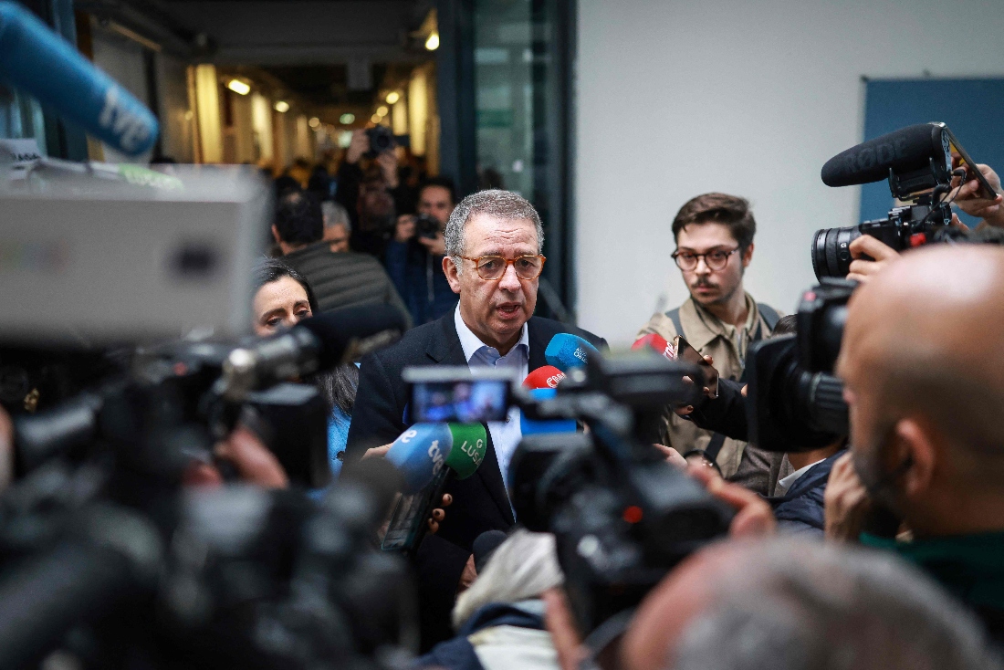Antonio Jose Seguro, speaks with journalists after casting his ballot for Portugal's presidential elections at a polling station in Lisbon, Portugal. (AFP)
