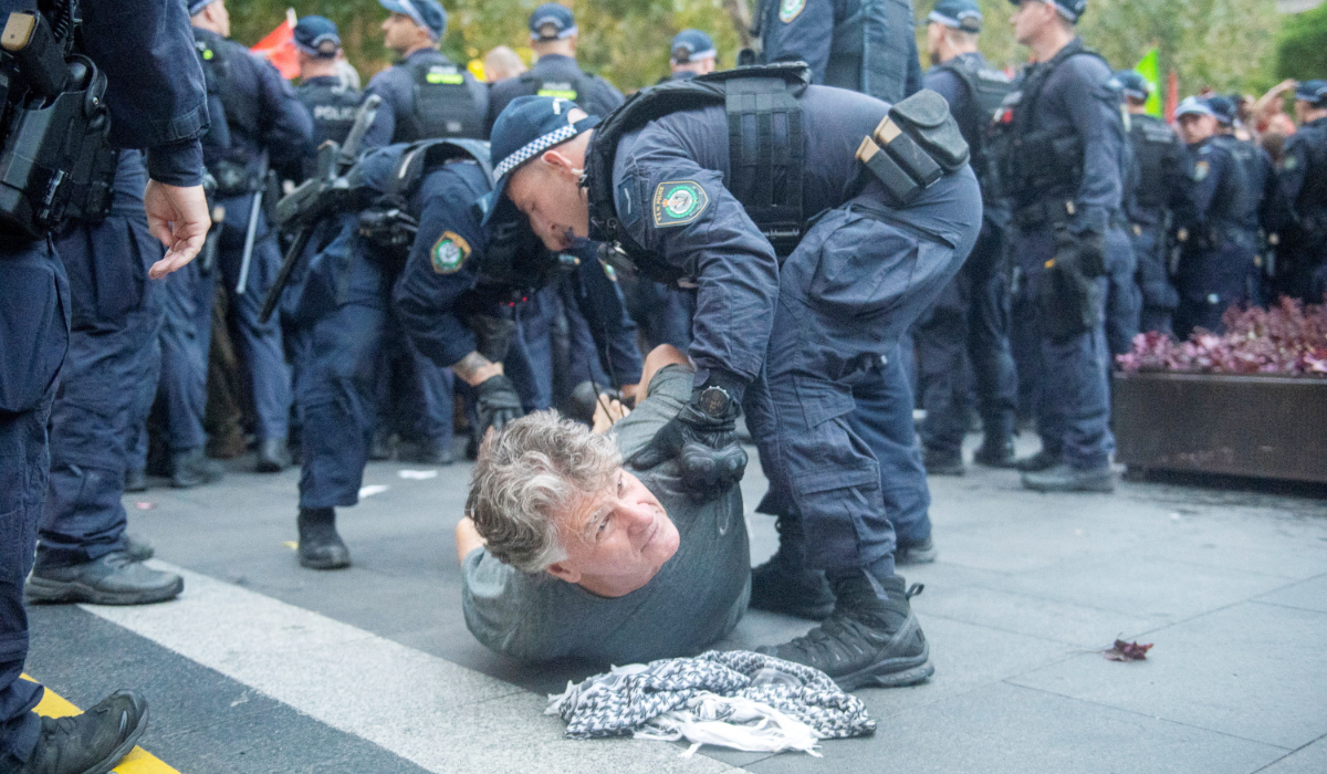 Police officers detain a protester as demonstrators gather at Town Hall Square to protest against Israeli President Isaac Herzog's state visit to Australia following a deadly mass shooting during a Jewish Hanukkah celebration at Bondi Beach on December 14, in Sydney, Australia, February 9, 2026. (REUTERS)
