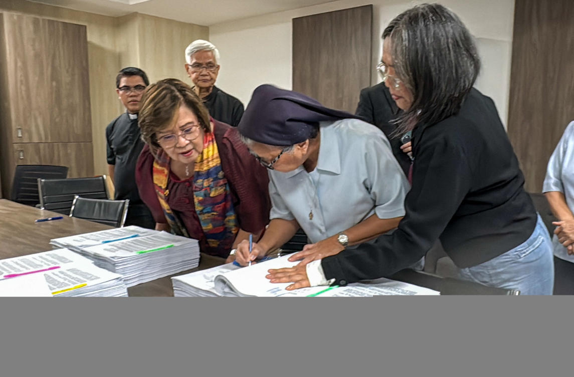 This handout photo from Mamamayang Liberal (ML) Partylist taken and received on February 9, 2026 shows members of the Philippine clergy filing an impeachment complaint against Philippine Vice President Sara Duterte at the House of Representatives in Quezon City, Metro Manila. (AFP)