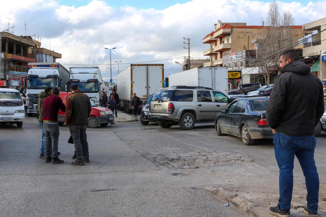 Lebanese truck drivers block the road on the Lebanese side of the Masnaa border crossing in protest against Syria's decision to ban non-Syrian trucks from entering its territory, on February 10, 2025. (Photo by Hassan JARRAH / AFP)