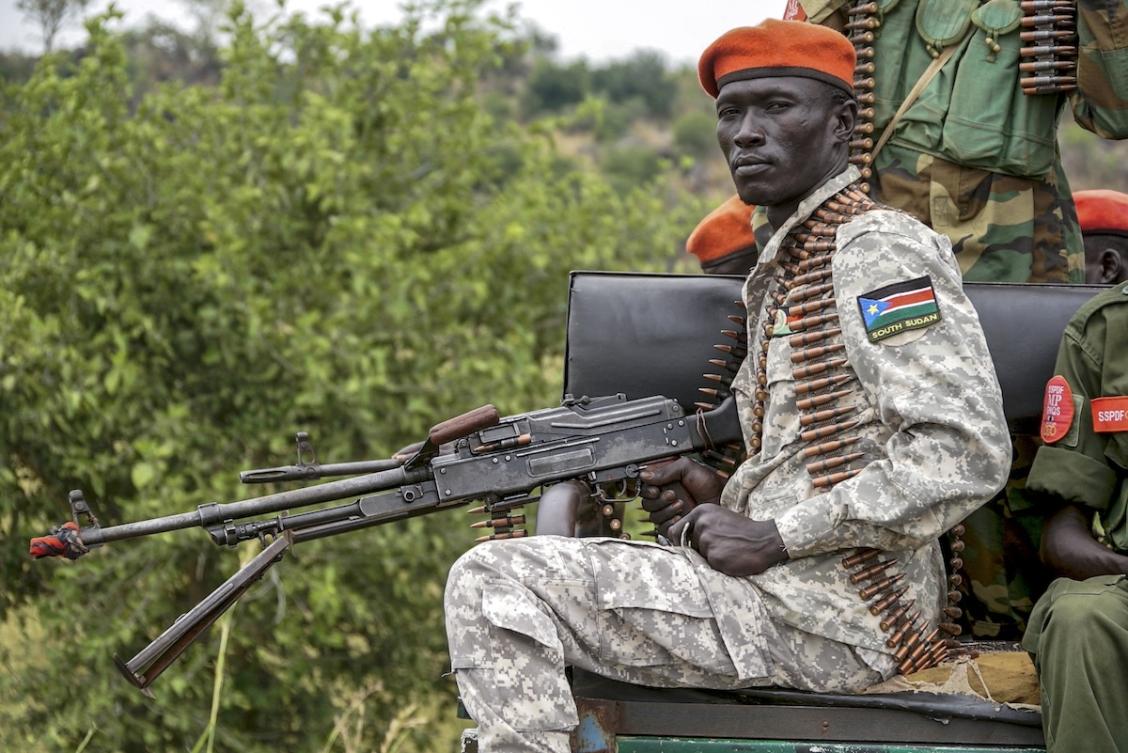 A South Sudanese military police officer sits on a pickup truck while monitoring the area as troops belonging to the South Sudanese Unified Forces take part in a deployment ceremony at the Luri Military Training Centre in Juba on November 15, 2023. (FILE/AFP)