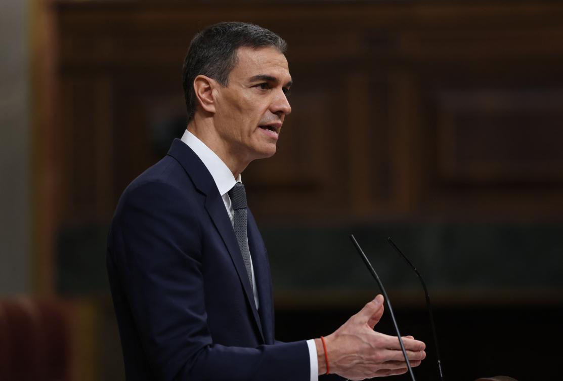 Spain's Prime minister Pedro Sanchez gestures as he addresses parliament over January train tragedy at the congress in Madrid on February 11, 2026. (Photo by Pierre-Philippe MARCOU / AFP)