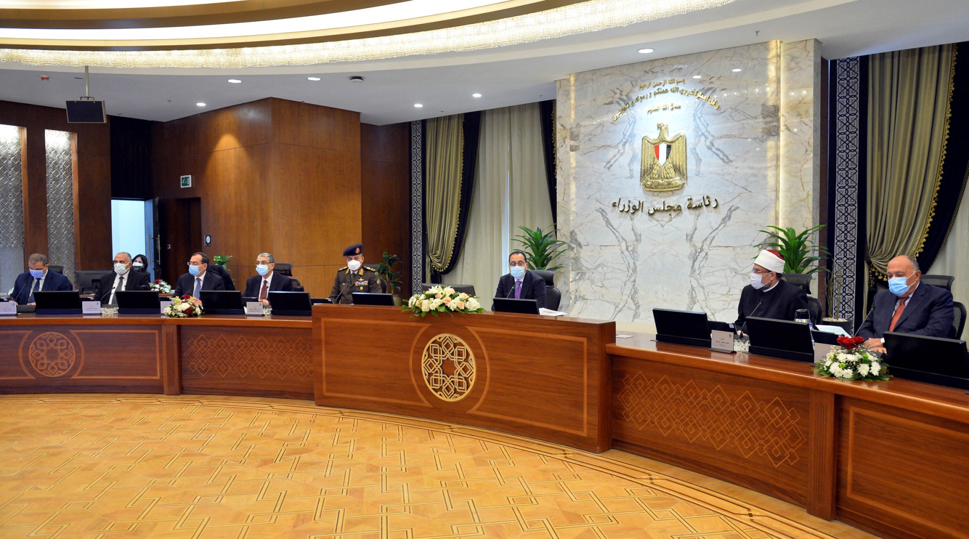 Egyptian Prime Minister Moustafa Madbouli (C) chairs the cabinet at the new headquarters in Egypt's New Administrative Capital, on December 23, 2021. (AFP)