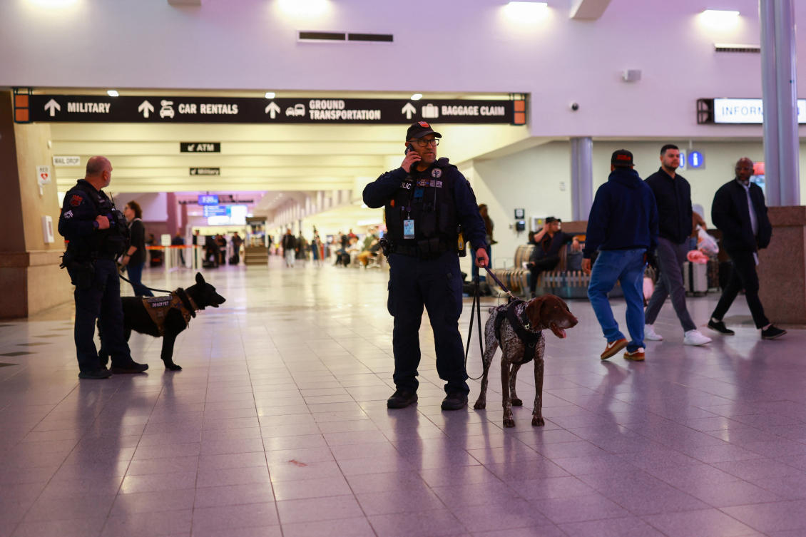 Above, police officers with K9 police dogs at El Paso International Airport after the US Federal Aviation Administration lifted its temporary closure of the airspace over El Paso on Feb. 11, 2026. (Reuters)