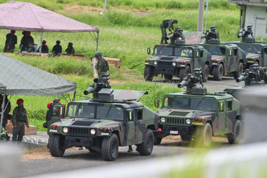 Above, military vehicles with US-made TOW A2 missiles during a live firing exercise in Pingtung county in Taiwan on July 3, 2023. (AFP file photo)