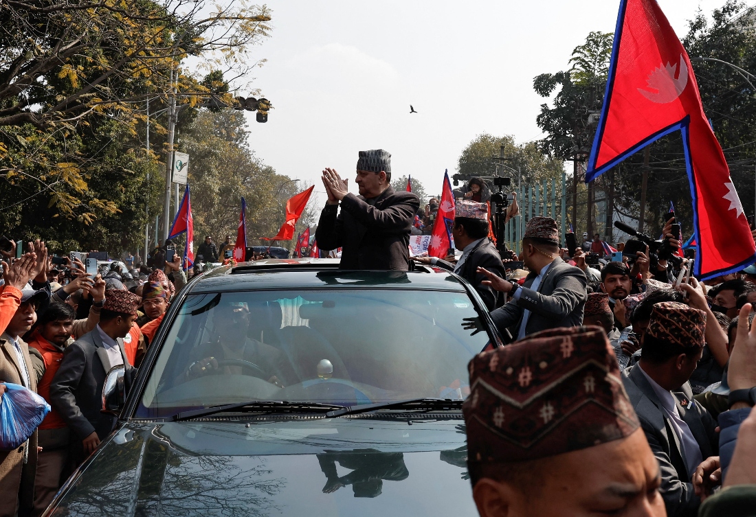 Former King of Nepal Gyanendra Bir Bikram Shah Dev is welcomed by the pro-monarchy supporters outside the Tribhuvan International Airport in Kathmandu, Nepal. (Reuters)