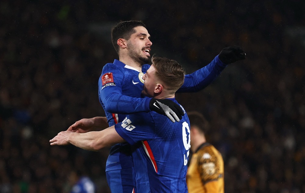 Chelsea’s Pedro Neto and Liam Delap celebrate their third goal, scored by Estevao. (Action Images/Reuters)