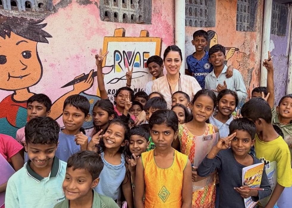 Indian artist and educator Rouble Nagi poses with children in Mumbai in this photo shared on Jan. 31, 2026. (Facebook/Rouble Nagi)