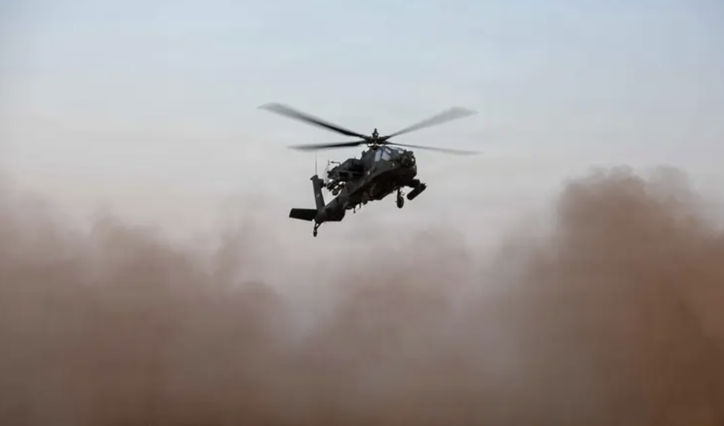 A US AH-64 Apache attack helicopter at an undisclosed location in the Middle East, which was used in recent anti-ISIS strikes in Syria. (US Central Command/File Photo)