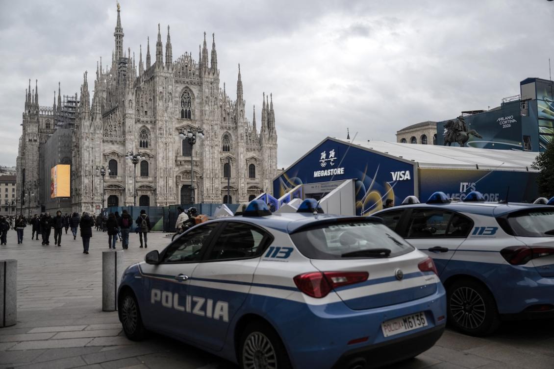 Italian Police cars are parked near the Megastore of Milano Cortina 2026 Olympic Games in Duomo’s square in Milan on January 27, 2026. (FILE/AFP)