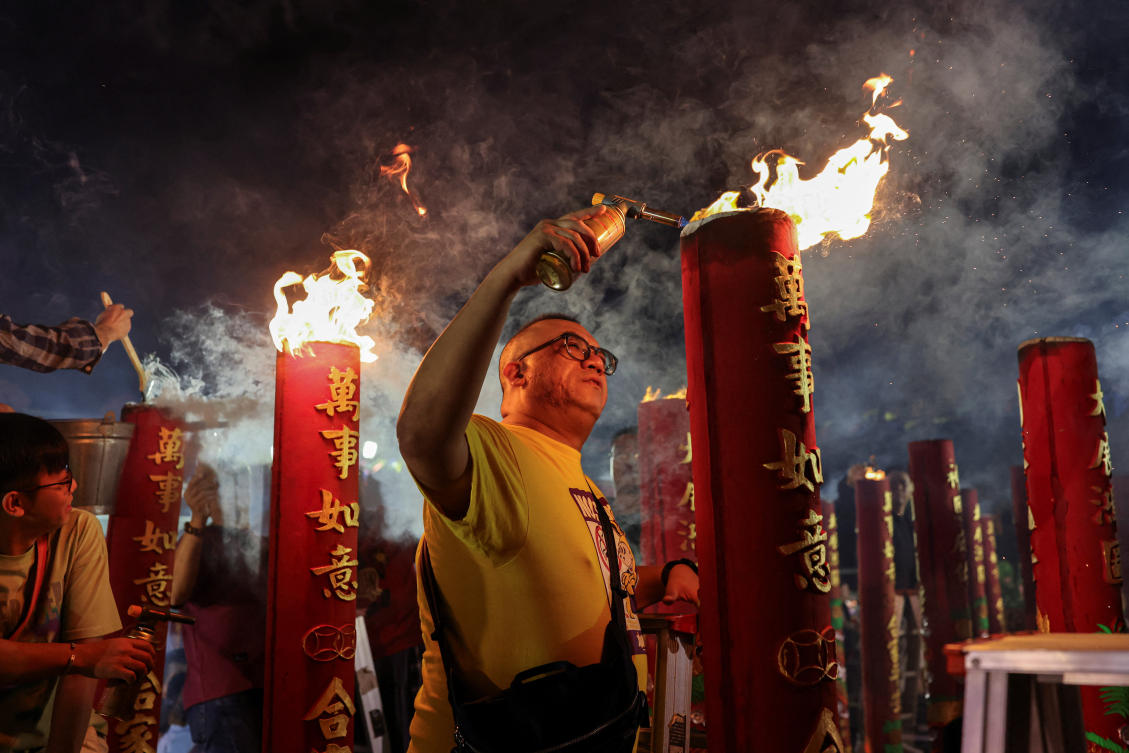Lunar New Year prayers, robots and festivities usher in the Year of the Horse