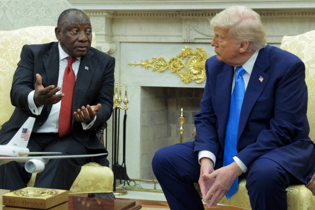 President of South Africa Cyril Ramaphosa speaks as US President Donald Trump listens during a meeting in the Oval Office of the White House in Washington DC, US. (AFP)