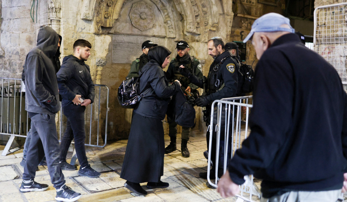 Palestinians walk through a checkpoint to enter Al-Aqsa Mosque as they prepare for the holy fasting month of Ramadan in Jerusalem's Old City, February 17, 2026. (REUTERS)