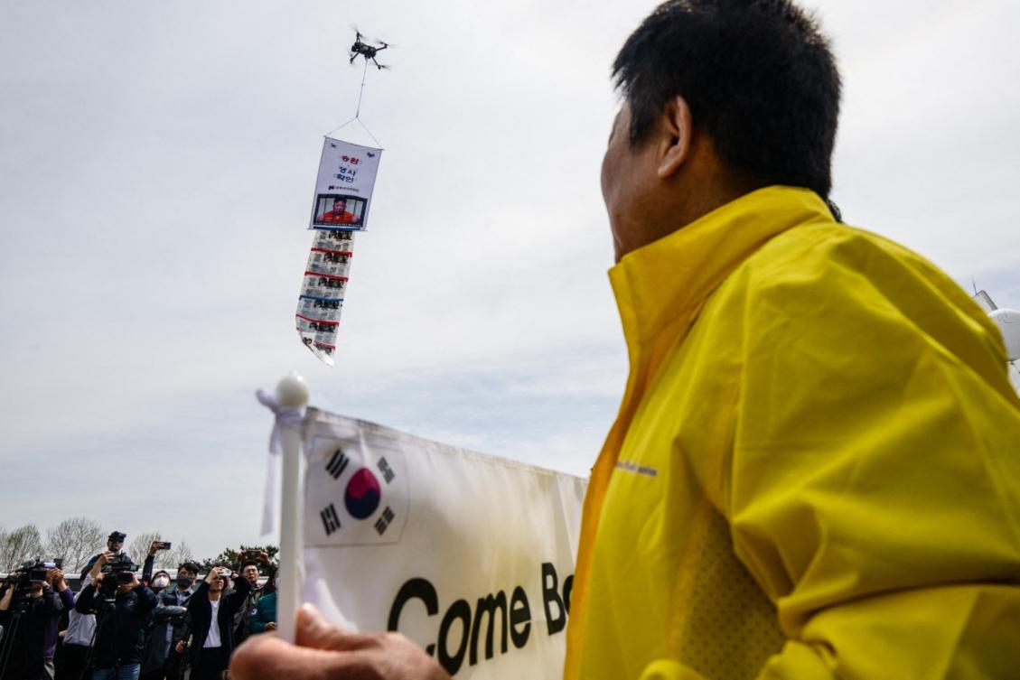 Above, a drone flies to display anti-North Korea propaganda leaflets at the Imjingak Pavilion near the Demilitarized Zone in Paju, north of Seoul on April 23, 2025. (AFP file photo)