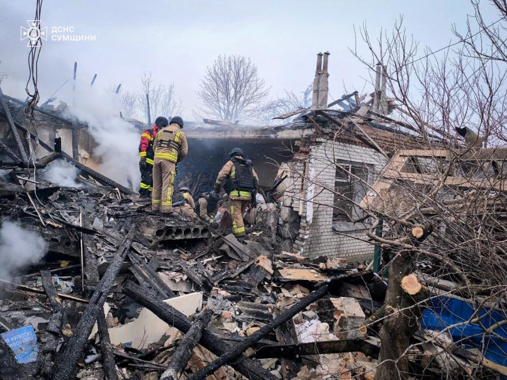 This handout photograph taken and released by the State Emergency Service of Ukraine on February 17, 2026, shows Ukrainian rescuers working in damaged private house at the site of a Russian attack in the Kyrykivka community of the Okhtyrka district Sumy region, amid the Russian invasion of Ukraine. (AFP)
