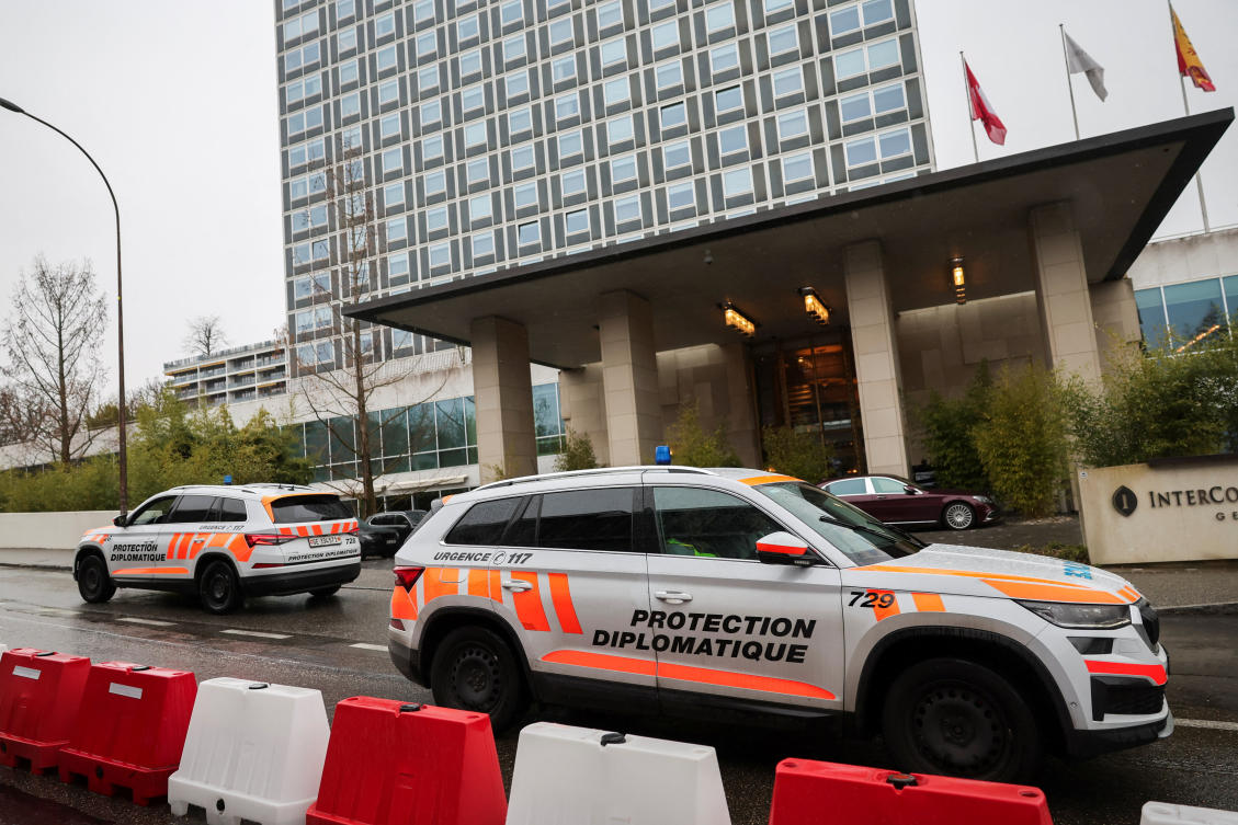 Cars belonging to security officials protecting the diplomats ply outside the InterContinental hotel as the US-mediated peace talks between Russia and Ukraine continue in Geneva on Feb. 18, 2026. (Reuters)
