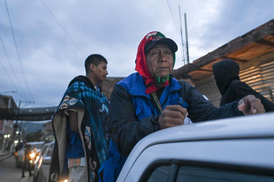 Indigenous guards from the Nasa community take part in the caravan of Indigenous leader Esneyder Gomez Salamanca, a candidate for a Peace Seat in Congress, in the Naya region, department of Cauca, Colombia, on February 12, 2026. (Photo by Joaquín SARMIENTO / AFP)
