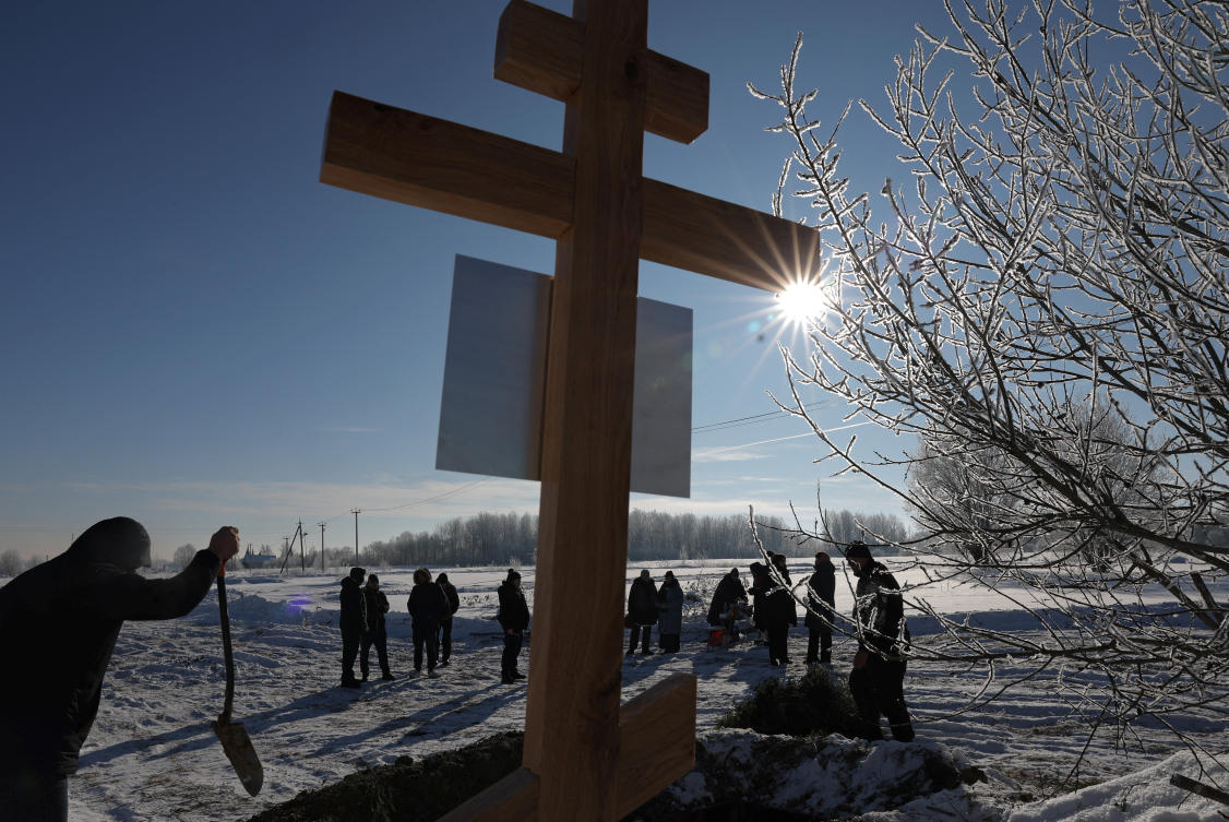 Above, people attend the funeral of a junior sergeant, who was killed in the course of the Russia-Ukraine conflict, in the village of Orzhitsy in the Leningrad region on Feb. 18, 2026. (Reuters)