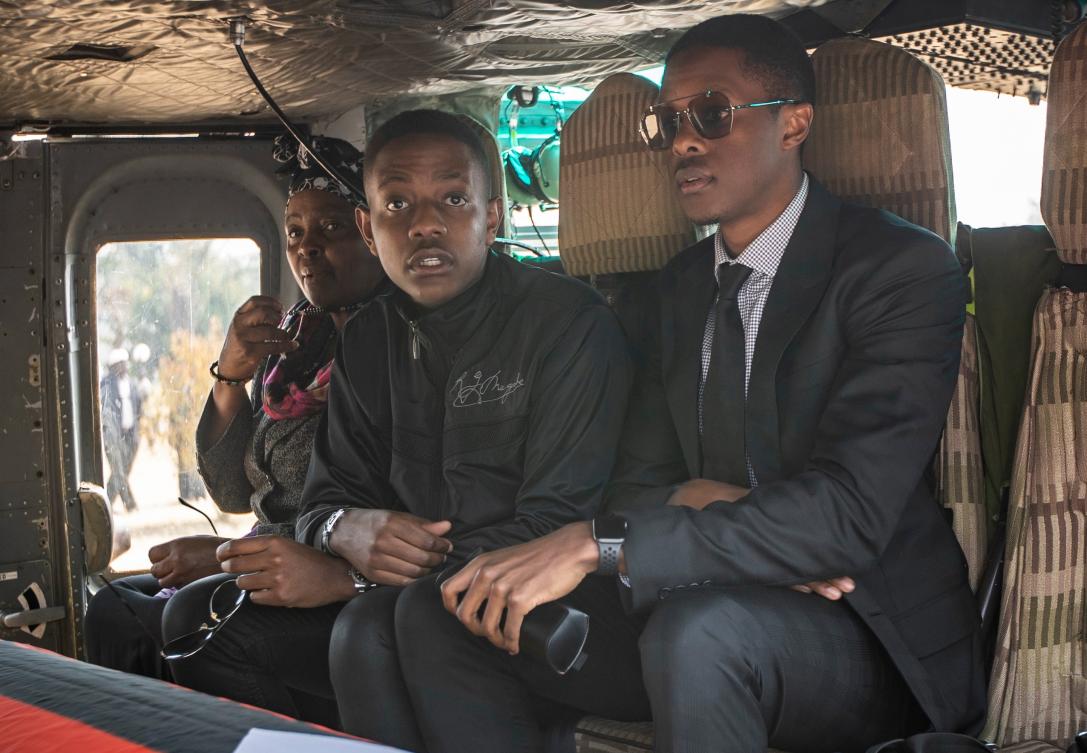 Former Zimbabwean President Robert Mugabe’s son Bellarmine Chatunga Mugabe, center, is seen with his brother Robert Mugabe Junior accompanying their father’s casket to his official residence in the capital Harare in 2019. (AP/File)
