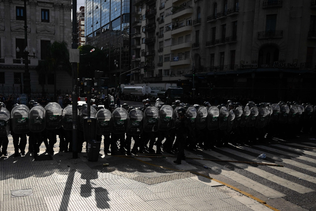 An Argentine police barricade stands guard during a protest outside the Congress building, where Argentina's President Javier Milei's labour reform is being treated, in Buenos Aires, Argentina. (AFP)